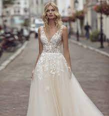 A fitted dress that fishtails out in a big skirt. Sneak Peek Modeca Bridal Portfolio 2021 Bridal Times