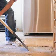 Remove the rounded, bullnose tile along the front of the countertop. Flooring Or Cabinets Which To Install First