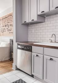 Matte Metro Tiles Backsplash And Grey Kitchen San Antonio Gray Benjamin Moore And Unfinished Cab Unfinished Kitchen Cabinets Eclectic Kitchen Kitchen Design