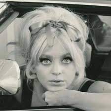 Goldie Hawn . I think most people picture Brigitte Bardot, Twiggy,  Priscilla Presley, Mia Farrow, or even Jackie O, when asked about iconic  60s hair. There was so much variety in that