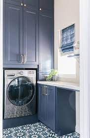 Get loads of convenient, organized storage with newage laundry room cabinets. Blue Laundry Room With Silver Washer Dryer Design Ideas