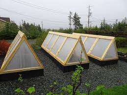 The sloped lid provides rain runoff. Diy How To Build Cold Frames Raised Bed Covers Newfoundland Gardening