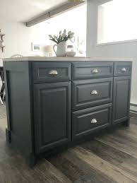 Kitchen islands are becoming a staple feature in love this bright white island with shaker style cabinets and cup handle hardware! Turning Base Cabinets Into A Kitchen Island Just Call Me Homegirl