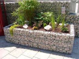 The gabion basket offers an easy way to build a strong retaining wall wherever you need to keep out the wind, precipitation, etc. 19 Fascinating Gabion Ideas To Improve Your Outdoor Space Raised Garden Garden Planters