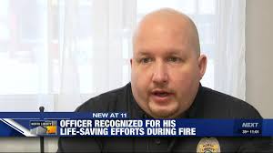 North Liberty officer recognized for life-saving efforts during ice cream  shop fire