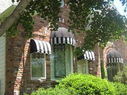 Dome And Quarter Barrel Awnings Add Contrast To This Red Brick Home House Awnings Red Brick House House Exterior