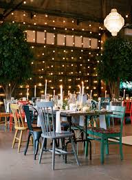 Southern Industrial Barn Wedding With Candlelit Tablescape At Soho South Cafe In Sava Industrial Barn Wedding Rehearsal Dinner Decorations Candlelit Tablescape