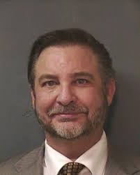 Hand doctor charged with assault of wife