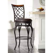 This comfortable owen bar & counter swivel stool is a mix of masculine, modern and urban design. Hartley 30 Wood And Bronze Metal Swivel Bar Stool 4v936 Lamps Plus