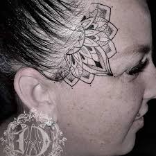 Image result for quirky pylon forehead tattoo