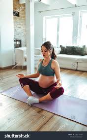 Pregnant Female Doing Yoga At Home Ad Affiliate Female Pregnant Home Yoga How To Do Yoga Photo Editing Stock Photos