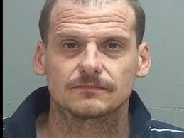 Man charged with killing woman who accused second man of rape