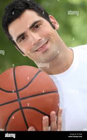 Black basketball player smiling hi-res stock photography and images