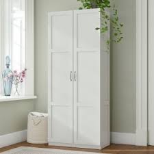 Its double doors feature handy magnetic latches, and open up to reveal one shelf and space for books, dishes, and other personal items, while its 32'' w surface hosts framed photos or favorite. Tall Wood Storage Cabinets With Doors You Ll Love In 2021 Visualhunt