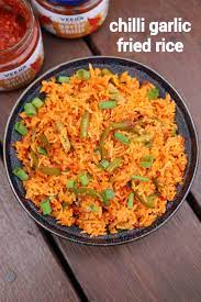 Chilli Garlic Fried Rice Recipe Spicy Garlic Fried Rice Recipe Recipe Garlic Fried Rice Indian Rice Recipes Fried Rice Recipe