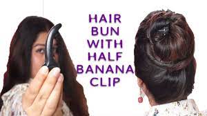 Rock those messy curls and turn this style into a low bun with some added hair wrapped around the hair band. Hair Bun With Half Banana Clip Youtube