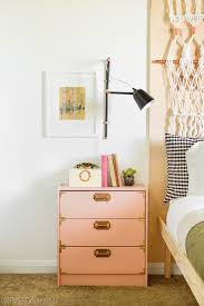 Gold ring pulls on white nightstand s beside a white wingback bed dressed with white bedding and various accent pillows. Ikea Hacks 50 Nightstands And End Tables