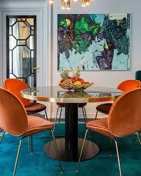 The Beetle Chair Shines In French Apartment Gorgeous Teal Tones Contrasting Against Bright Oranges Luxe Dining Room Dining Room Small Dining Room Contemporary