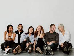 Download Premium Image Of Group Of Cheerful Diverse People Sitting On A Company Photoshoot Team Photography Business Group Photos Team Photoshoot