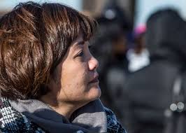 April Vasquez watches as her husband, U.S. Navy Fire