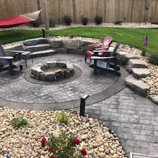 Stamped concrete patio with fire pit sale, surrounded by armen. Stamped Concrete Fire Pit Walkway Edmonton Concrete Ltd