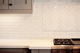 We love the fresh appeal of a white subway tile kitchen backsplash. Herringbone Backsplash Contemporary Kitchen Benjamin Moore Museum Piece Madison Taylor Design
