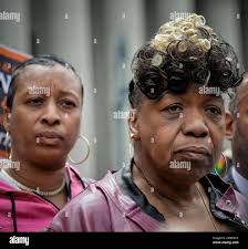 In this Thursday May 9, 2019 photo, Ellisha Garner, left, and Gwen Carr,  right, her mother and mother of Eric Garner, an unarmed black man who died  as he was being subdued