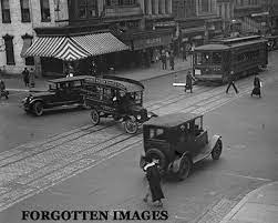 Trolley Car And Automobile Traffic C 1920 I Chose This Picture Because It Shows How The Traffic Looked In The 1920s Model T 1920s Car Street Scenes