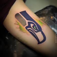 And this seahawks tattoo combining the logo with the seattle skyline is truly inspired. Tattoo 013 Tattoo013 Seahawks Facebook