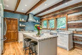 Shaker designs and simple flat panel designs both work well. Sophisticated Rustic Log Cabin Kitchen Rustikal Kuche Nashville Von Frenchs Cabinet Gallery Llc Houzz