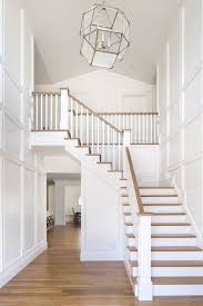 The black metal fabrication is sleek and grounds the white and light finishes found elsewhere in the open living space. Beautiful Staircase Idea If We Ever Extend The Addition Over The Dining Room And Have More High Ceiling Spa Staircase Remodel Stair Railing Design House Stairs
