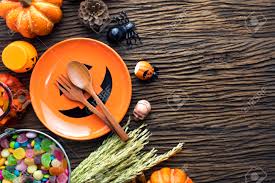 Host a spooky soiree with these halloween dinner party menu ideas. Orange Dish And Decorations Of Halloween Dinner Party On Wooden Table Ground Stock Photo Picture And Royalty Free Image Image 89464057