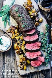 Medallions of beef tenderloin are covered with a creamy porcini mushroom sauce and surrounded by new potatoes then roasted to savory perfection. Slow Roasted Beef Tenderloin With Horseradish Cream Sauce Give It Some Thyme Recipe Slow Roasted Beef Tenderloin Horseradish Cream Sauce Horseradish Cream