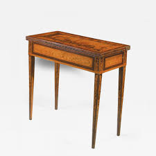 The square table is perfect for playing cards and can also be converted into a dining table. Gaetano Renoldi An Inlaid And Veneered Wood Neoclassic Card Table