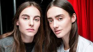 Middle part bangs and updo Two Experts On Mastering The Middle Part Hairstyle Stylecaster
