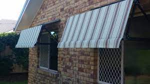 These Fabric Awnings Are Great On These Windows I Love How They Re Just Big Enough To Keep The Sun Out We D Lo Fabric Awning Living Room Windows House Design