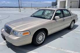 Image result for Medium Gold 1998 Town Car