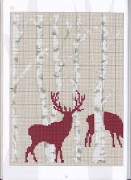 A deer rests among the flowers in this folk art inspired cross stitch design by kathy barrick. 91 Cross Stitch Deer Ideas Cross Stitch Stitch Cross Stitch Animals