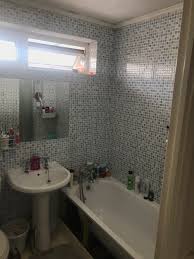 The deep royal blue vanity and wallpaper help to give the small space a more robust feel and add depth. Bathroom With Stair Bulkhead Diynot Forums