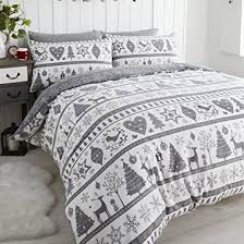 Crafted from cotton, each piece in this set is dotted with the embroidered pattern of a red pickup truck hauling a christmas tree on a beige background. 26 Christmas Bedding Sets Best Christmas Duvet Covers