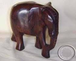 The malachite for this carving was sourced from the congo where the finest quality of this mineral is currently found. African Wooden Hand Carved Elephant