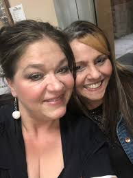 Sandy doing what Sandy loved best. I will miss our hugs.