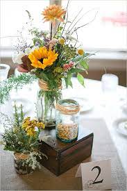 Diy Rustic Wagon Wheel Wedding Wildflower Centerpieces Diy Wedding Decorations Wedding Centerpieces