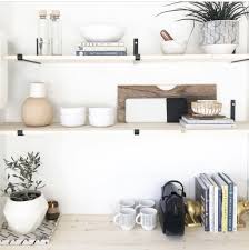 5 Must Have Shelf Decor Items For Intentional Design Allisa Jacobs Corner Fireplace Furniture Arrangement Shelf Decor Living Room Furniture Layout