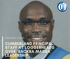 Amid claims of political interference in the selection of Darien Henry as  the principal-in-waiting of Cumberland High School, the acting headmaster  is embroiled in a heated dispute with academic staff who accuse