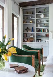 Tapered legs, clean lines and subtle tufting add fashionable flair, while the deep seat and winged back offer cozy comfort. 6 Ways To Create A Classically Current Design By Laura U Interiors Emerald Green Living Room Living Room Green Gray Built Ins
