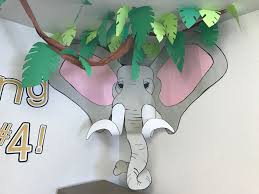 To create an immediate natural vibe, consider decorating with lush jungle leaves in an array of vibrant shades of green. Construction Paper Elephant Kids Classroom Jungle Theme 2nd Grade Wall Decor Jungle Theme Classroom Safari Theme Classroom Jungle Theme
