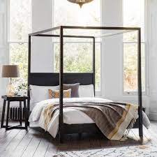 The classic wooden four poster bed is renowned for its prestigious appearance and size while maintaining a simple and elegant design. Zephyr Black Wooden Four Poster King Size Bed Frame Cult Furniture