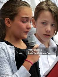 Ethan Kramer, right, looks to classmate Amelia Myre as she sheds... News  Photo