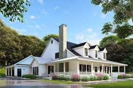 The facade of the house is faced with board and batten siding and 4 horizontal windows, similar to clusters, above the porch. Fall Time Farmhouse And Cabin Plans Blog Dreamhomesource Com